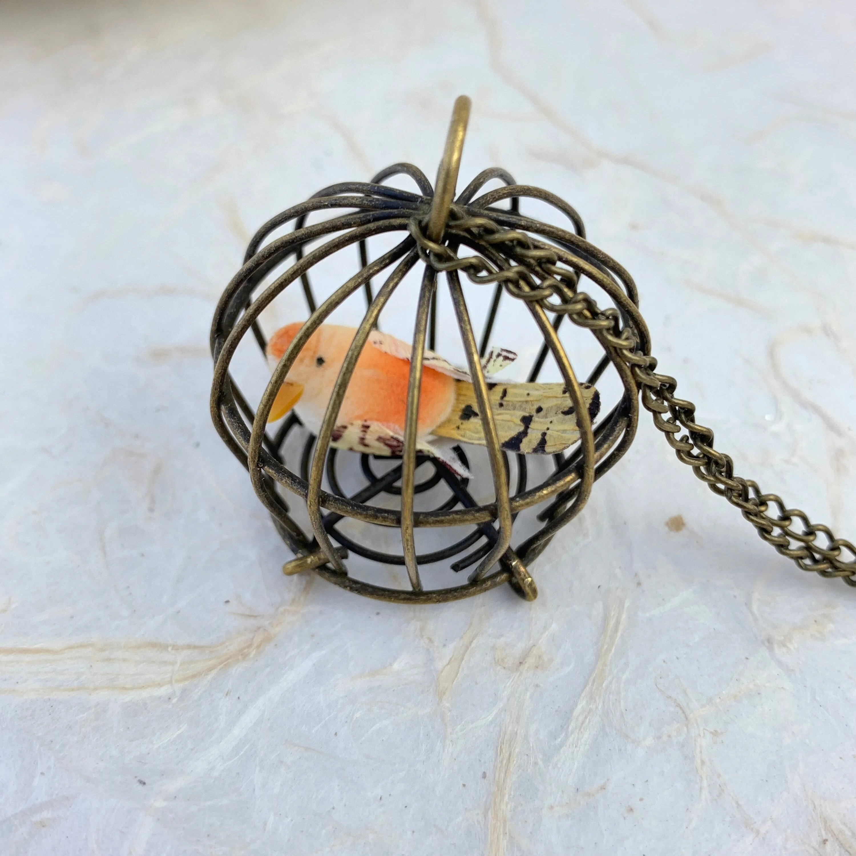 Little Bird In A Vintage Birdcage Pendant Necklace in Begonia
