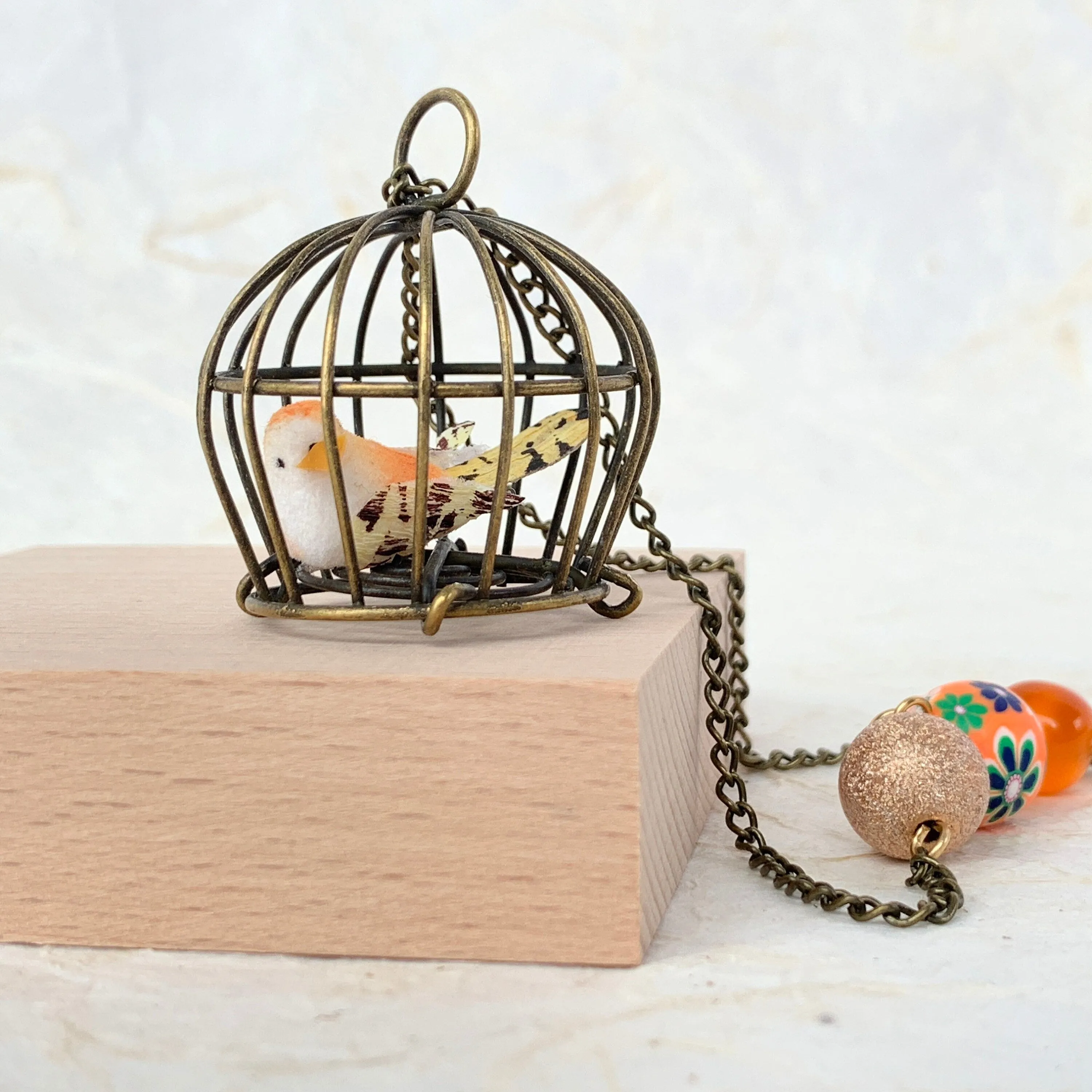 Little Bird In A Vintage Birdcage Pendant Necklace in Begonia