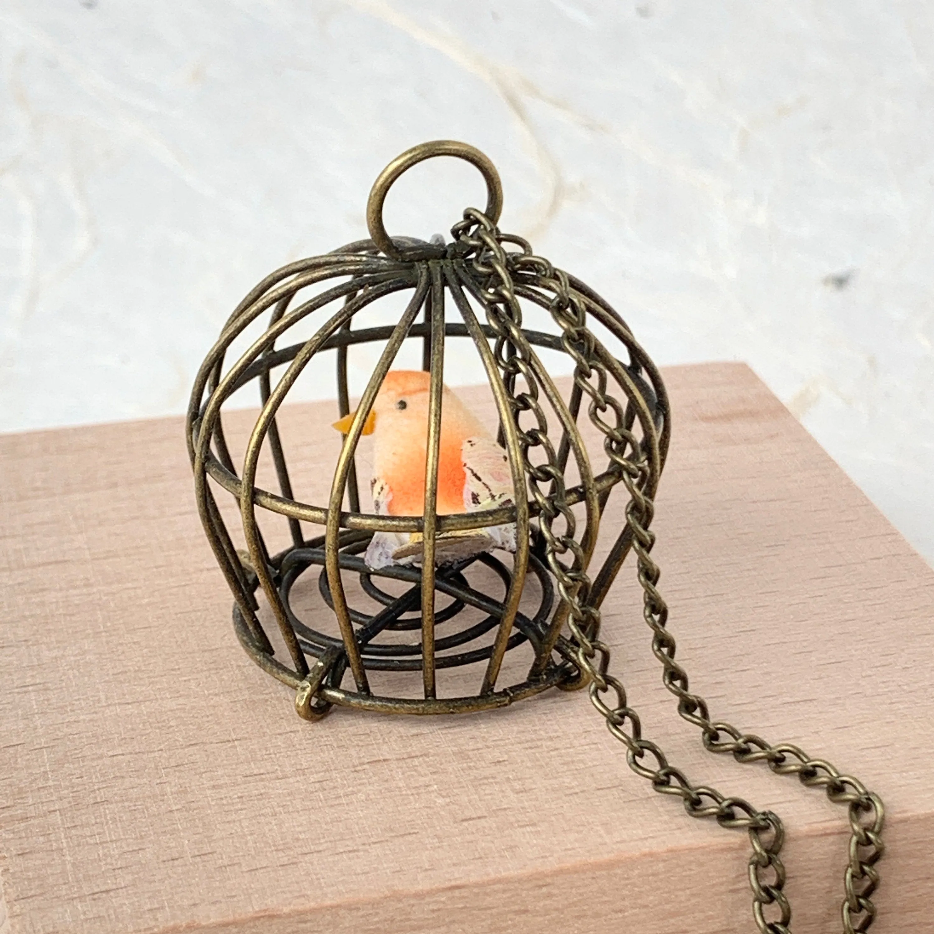 Little Bird In A Vintage Birdcage Pendant Necklace in Begonia